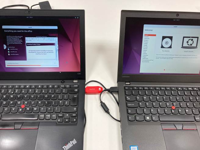 Two laptops showing Linux Ubuntu installing.